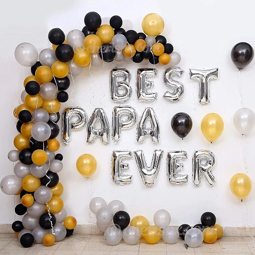 black and golden balloon decoration 